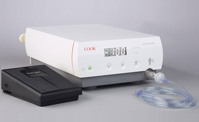 Cook medical aspiration pump with digital vacuum display and foot pedal for oocyte retrieval.