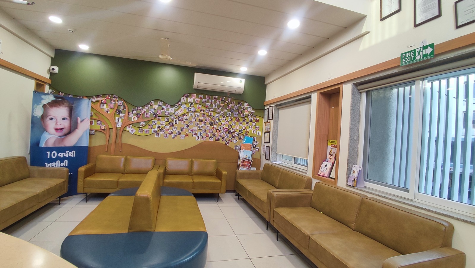 Waiting lounge with success-story tree wall of babies born at Global IVF Centre Rajkot