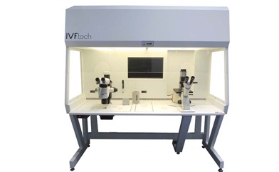 IVFtech Denmark laminar air flow IVF workstation with integrated heated tabletop and stereo microscopes.