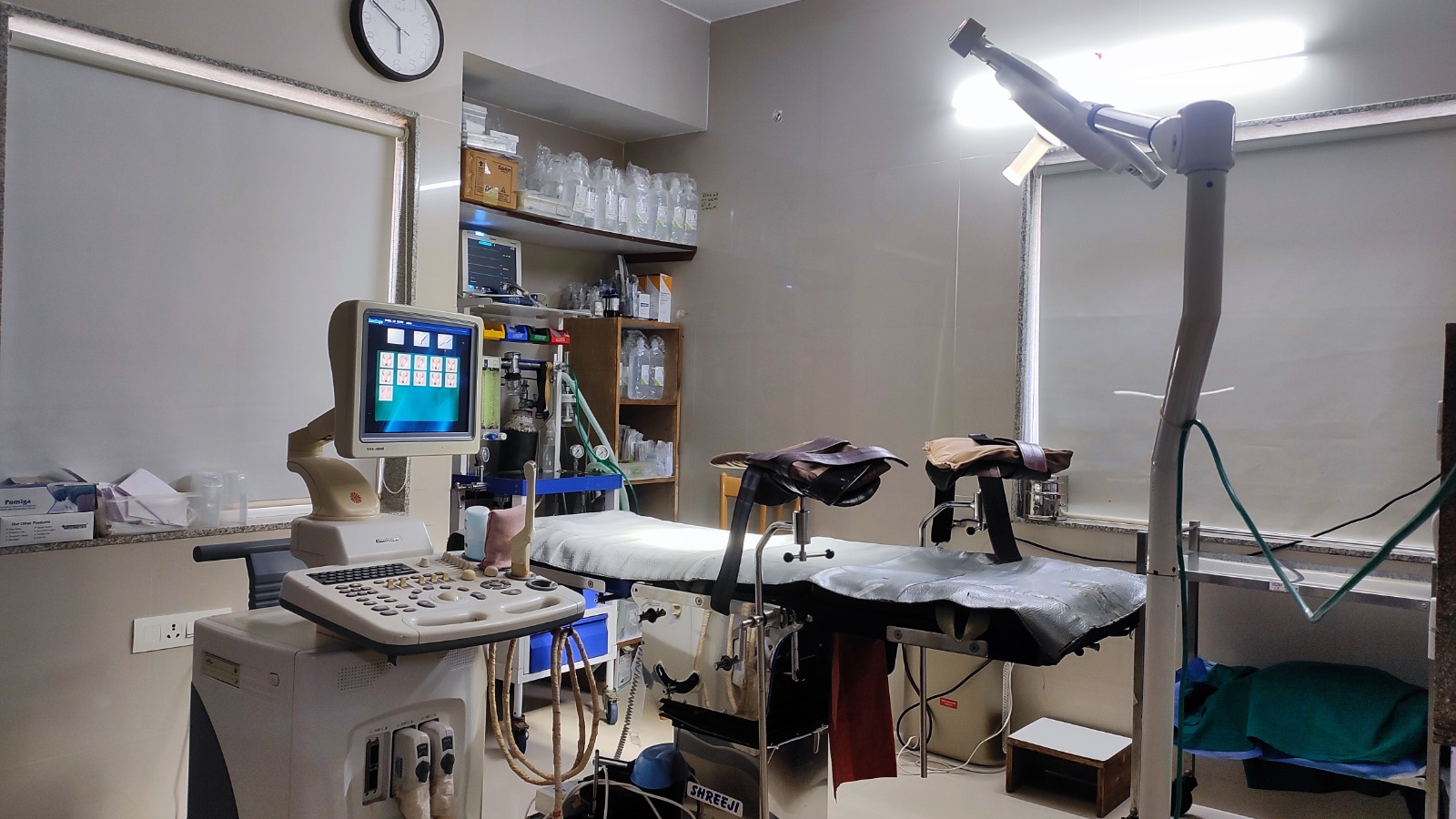 Sonography-guided procedure room with GE ultrasound and modular gynaec table at Global IVF Centre