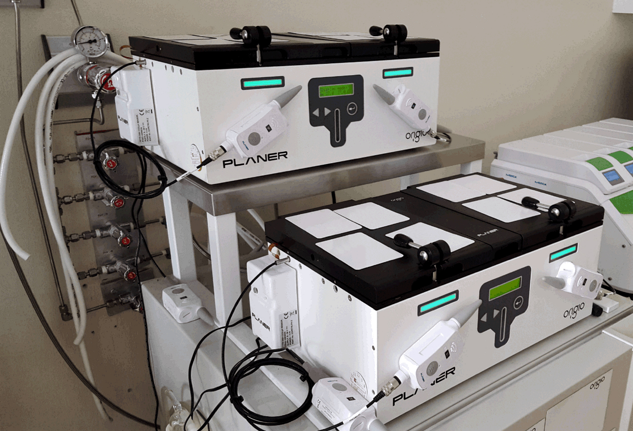 Planer BT37 benchtop IVF incubators stacked in a laboratory with gas lines connected — embryo culture system with precise temperature and pH control.