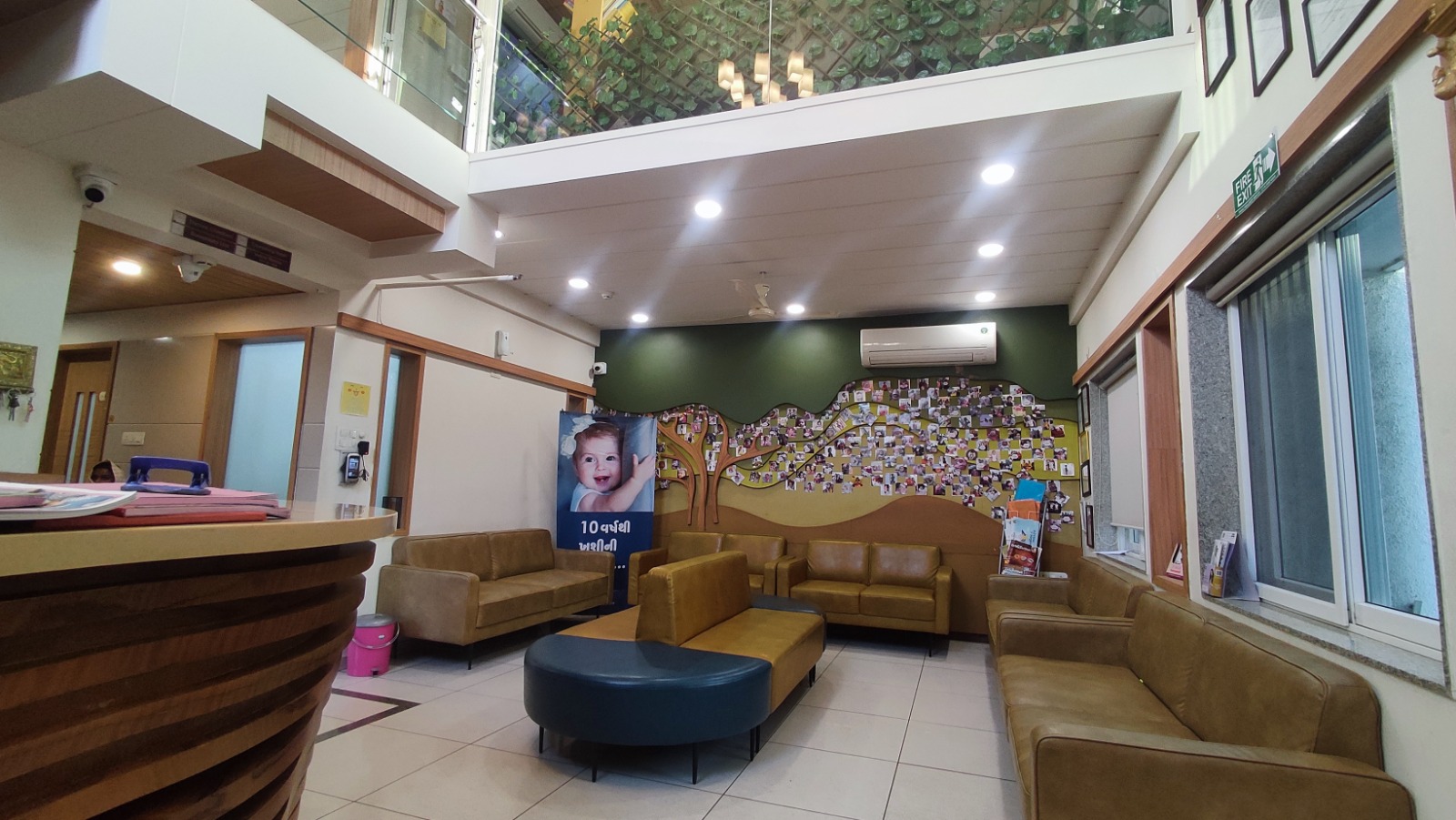 Reception desk and lobby with success-story wall at Global IVF Centre Rajkot
